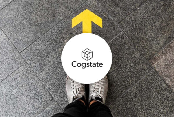 Cogstate logo over footpath with arrow