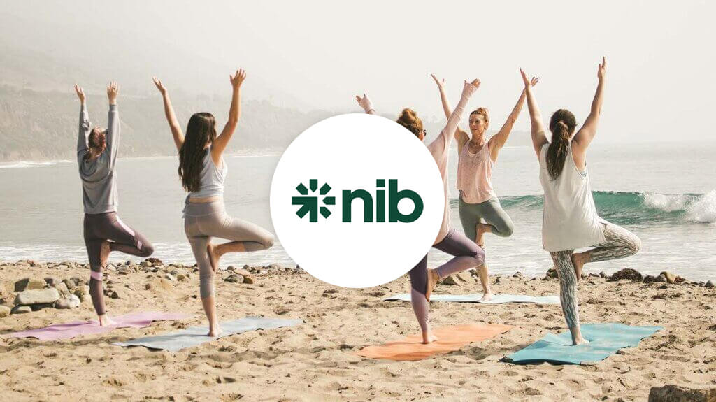 NIB logo with yoga class at beach in background