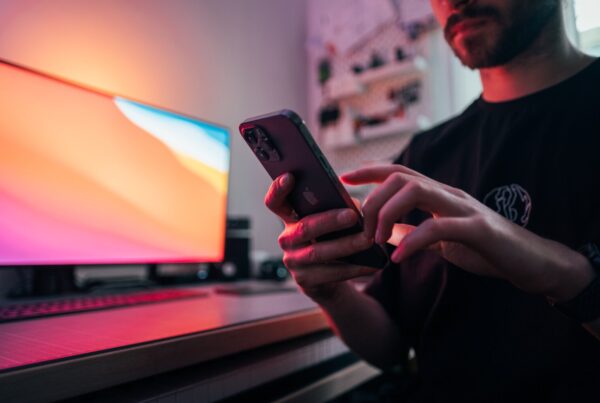 Man using mobile phone at desk